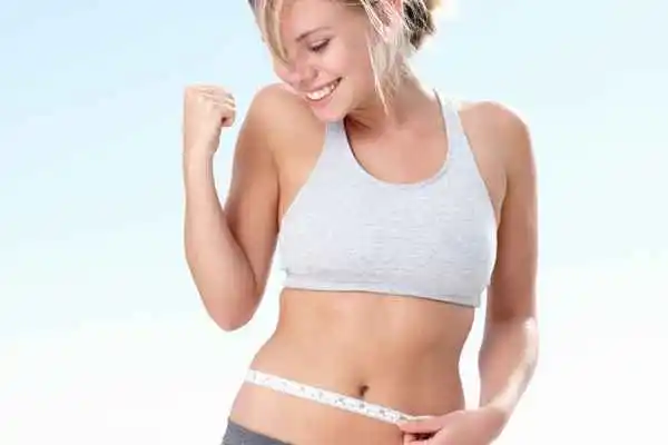 woman happy after fat reduction treatment Surbiton
