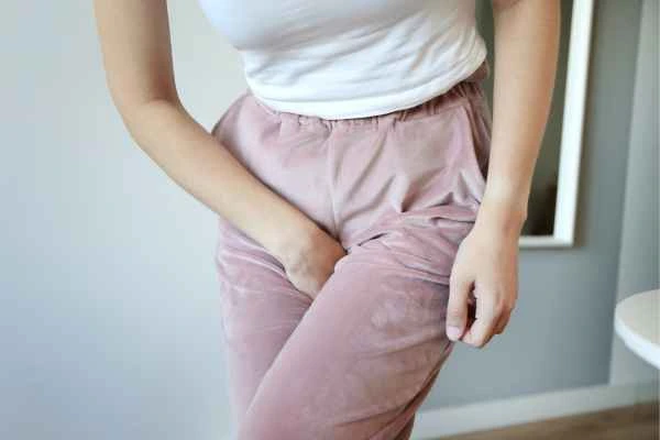 older woman running to the toilet because of urinary incontinence Surbiton