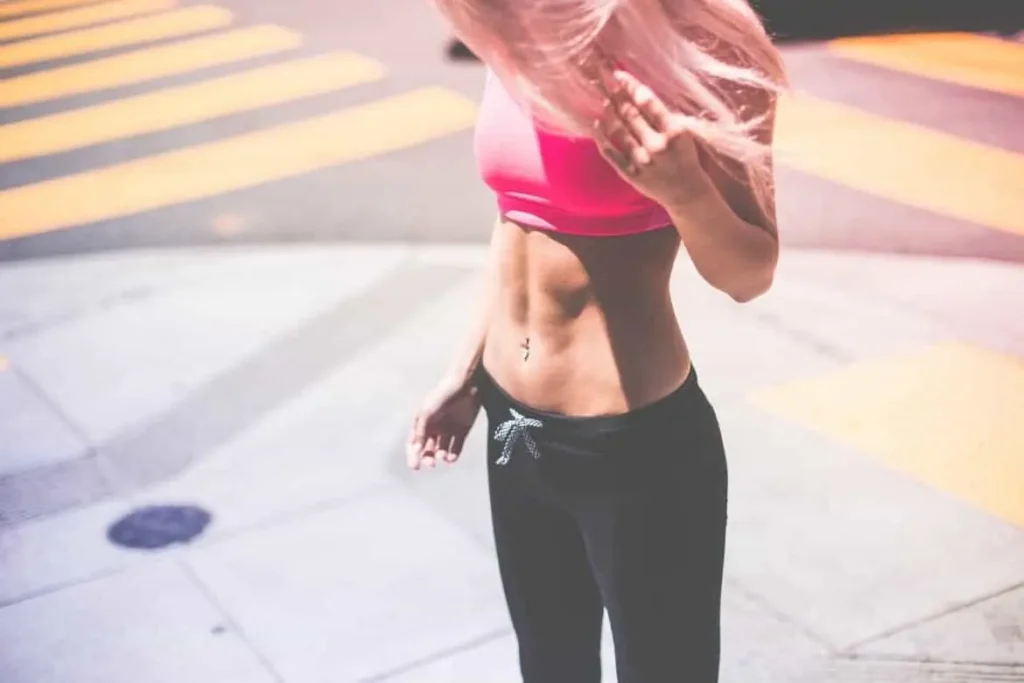 Woman with toned stomach after LA-EMS Body Sculpting Treatment Surbiton
